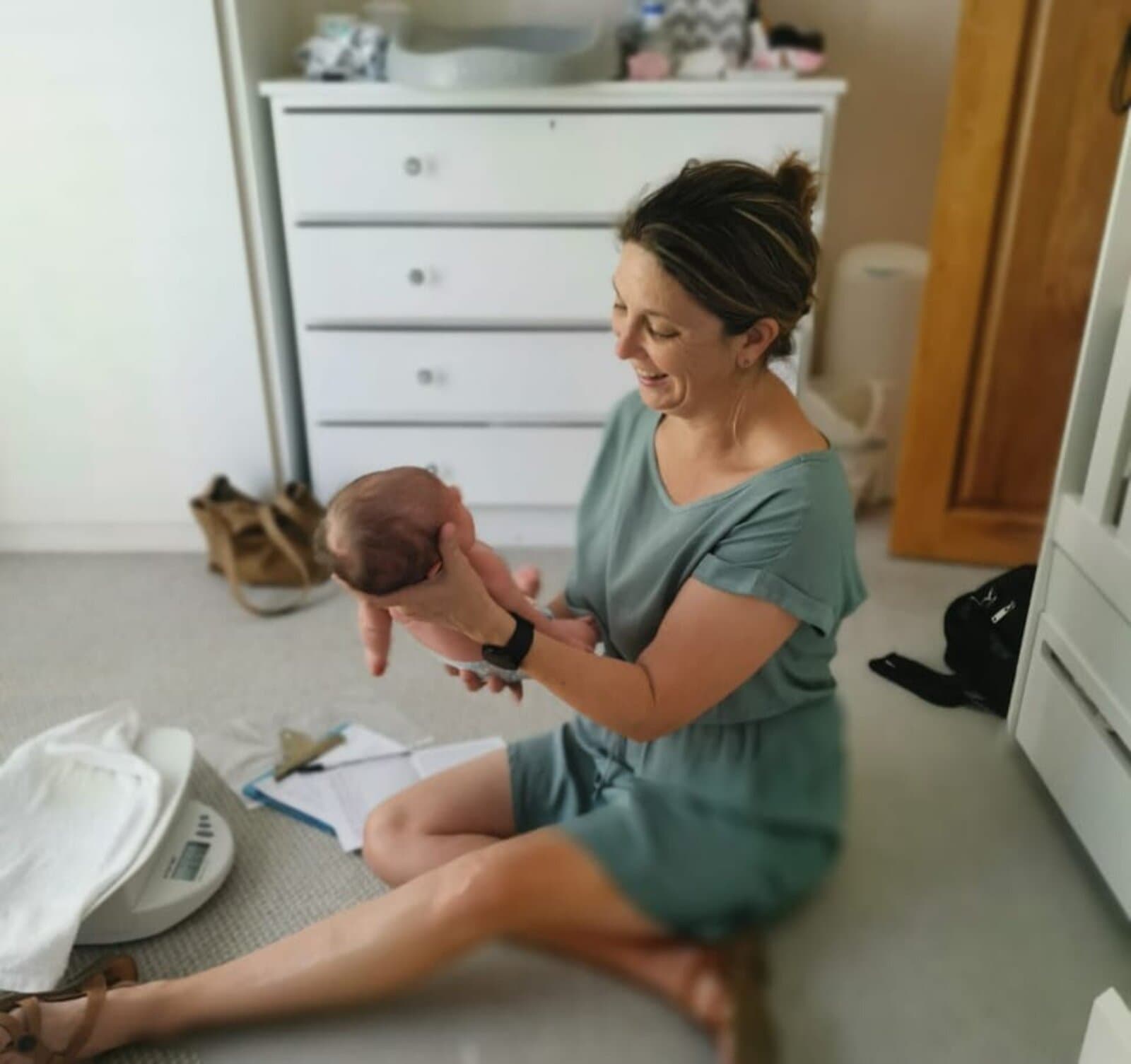 Megan on a postnatal home visit with a newborn